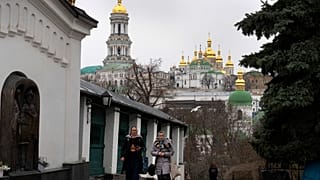 People walk in the Monastery of the Caves, also known as Kyiv-Pechersk Lavra in Kyiv, Ukraine, March 23, 2023