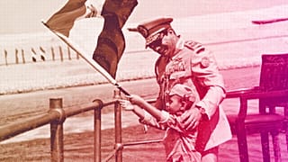 Egyptian President Abdel-Fattah el-Sissi smiles at a boy dressed in a military uniform during a ceremony unveiling a major extension of the Suez Canal in Ismailia, August 2015