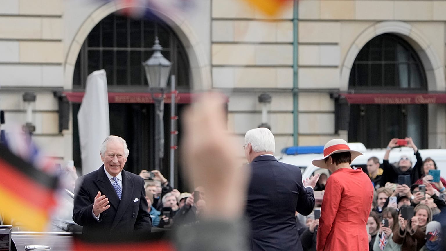 German President Frank-Walter Steinmeier and his wife Elke Buedenbender, right, welcome Britain's King Charles III and Camilla in front of the Brandenburg Gate, Berlin, 29 Mar