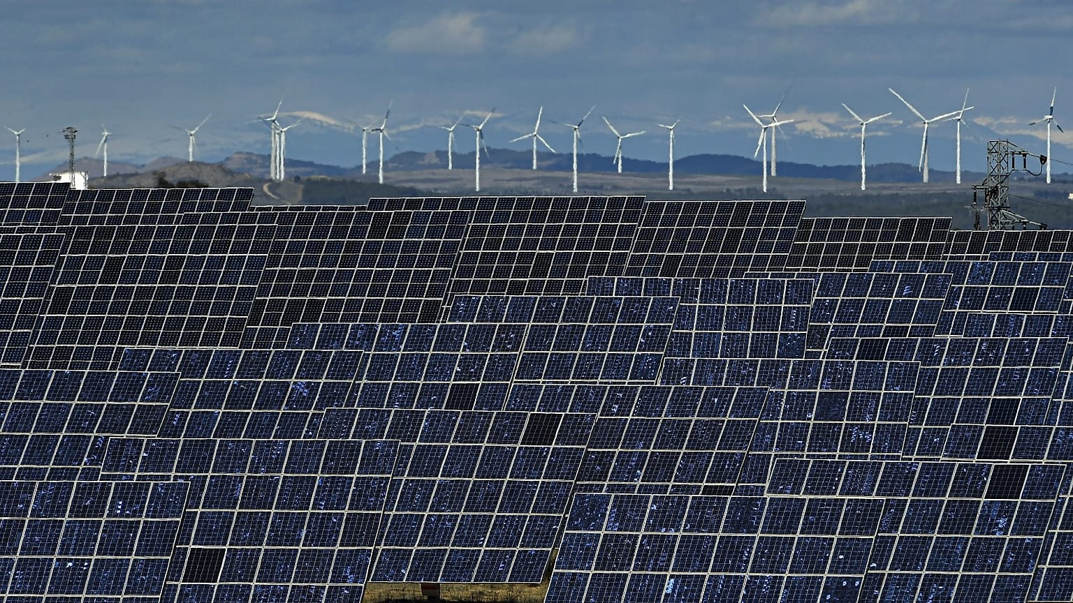 Solar panels work near the small town of Milagro, Navarra Province, northern Spain, on Feb. 24, 2023. 