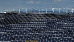 Solar panels work near the small town of Milagro, Navarra Province, northern Spain, on Feb. 24, 2023. 