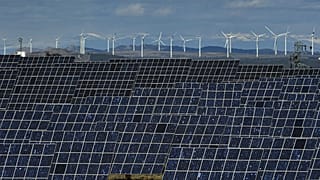 Solar panels work near the small town of Milagro, Navarra Province, northern Spain, on Feb. 24, 2023.