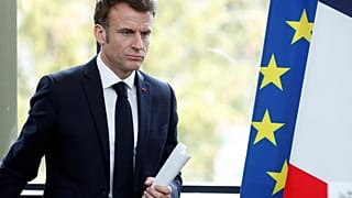 French President Emmanuel Macron arrives to deliver a speech in Sainte-Savine-Le-Lac, southeastern France, Thursday, March 30, 2023.