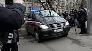 A van carrying Wall Street Journal reporter Evan Gershkovich leaves the Lefortovsky court, in Moscow, Russia, Thursday, March 30, 2023.