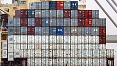 FILE - Shipping containers aboard a cargo ship at port of Southampton, southern England, Jan. 1, 2021. 