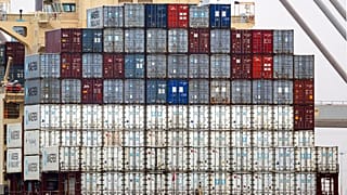 FILE - Shipping containers aboard a cargo ship at port of Southampton, southern England, Jan. 1, 2021. 
