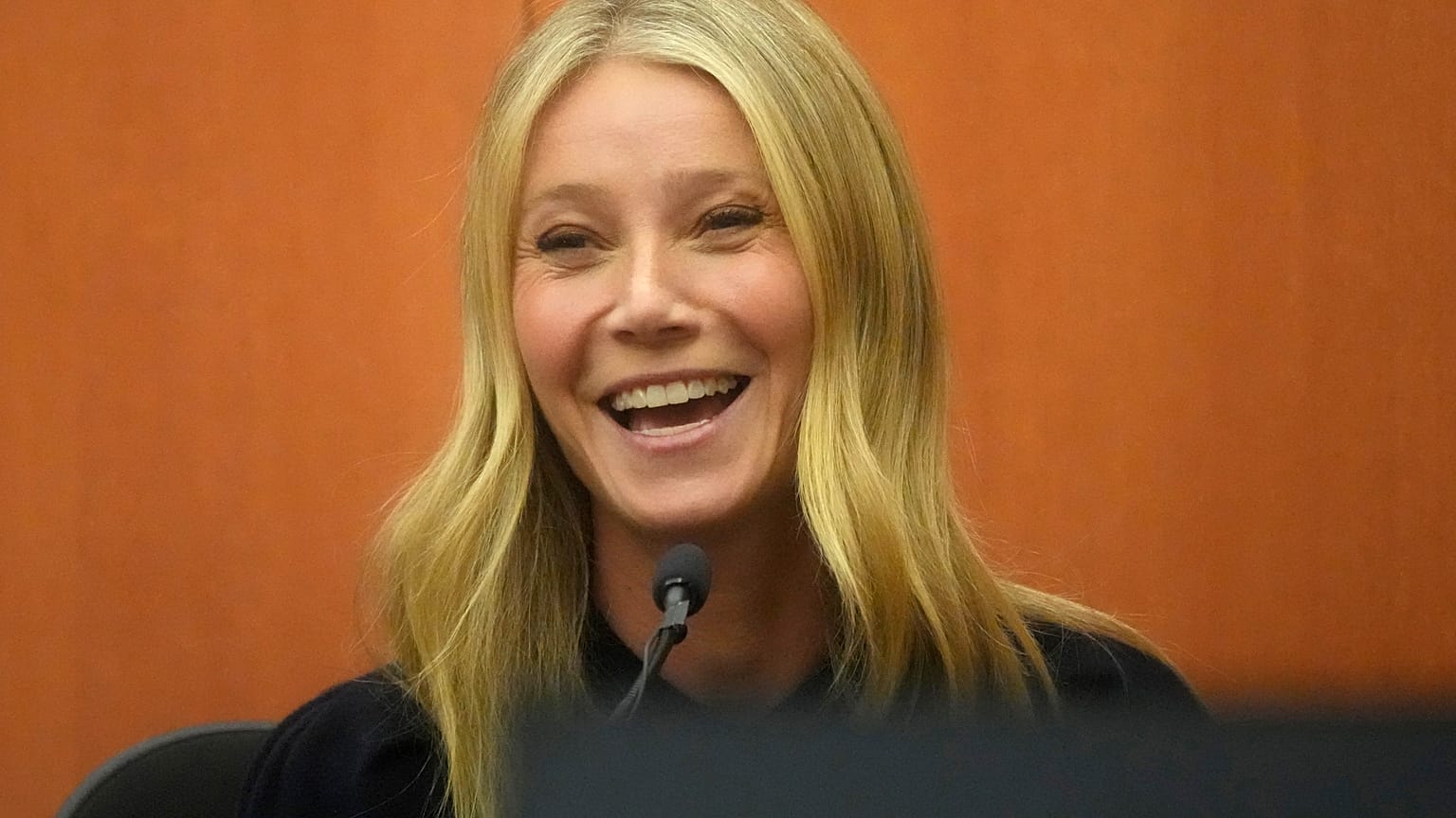 Gwyneth Paltrow laughs on the stand during her televised trial 