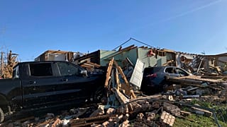 A home and vehicle is damaged from a storm in Little Rock, Ark., on Saturday, April 1, 2023.