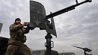 A Ukrainian soldier of a mobile air defence unit demonstrates his skills at the Antonov airport in Hostomel, on the outskirts of Kyiv, Ukraine, Saturday, April 1, 2023.