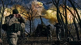 krainian soldiers fire a self-propelled howitzer towards Russian positions near Bakhmut, Donetsk region. 