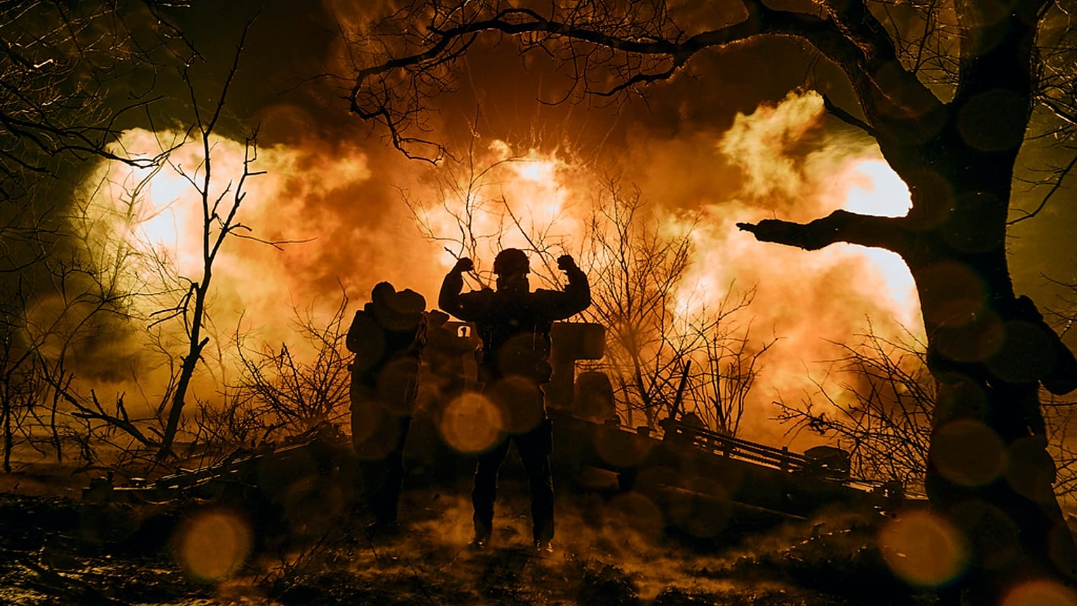 Ukrainian soldiers fire artillery at Russian positions near Bakhmut. 