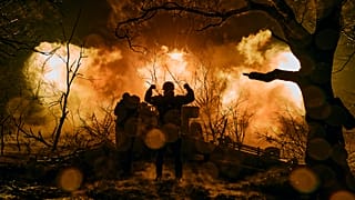 Ukrainian soldiers fire artillery at Russian positions near Bakhmut.