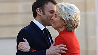 French President Emmanuel Macron hugs European Commission president Ursula van der Leyen as she arrives for a working lunch, Monday April 3, 2023 at the Elysee Palace in Paris