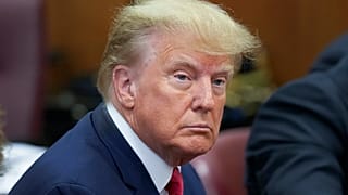 Former President Donald Trump sits at the defense table with his defense team in a Manhattan court, April 4, 2023, in New York. 