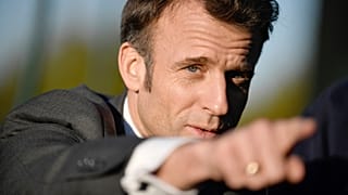 French President Emmanuel Macron gestures as he attends a soccer training session for neurodivergent children outside Paris, Tuesday April 4, 2023. 