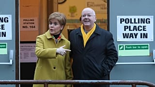 FILE: Former Scottish First Minister Nicola Sturgeon poses for the media with husband Peter Murrell, outside polling station in Glasgow, Scotland, December 2019