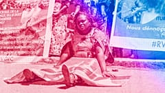 A woman holds a Democratic Republic of Congo (DRC) flag during a protest against the conflict in eastern DRC, February 2023