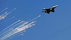 A Serbian Army MiG-29 jet fighter performs during ceremony in Batajnica, military airport near Belgrade, Serbia. 