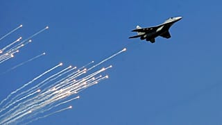 A Serbian Army MiG-29 jet fighter performs during ceremony in Batajnica, military airport near Belgrade, Serbia. 
