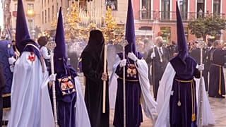 Antonio Daniel Mira (wearing a black tunic) during the procession of Jesús El Rico.