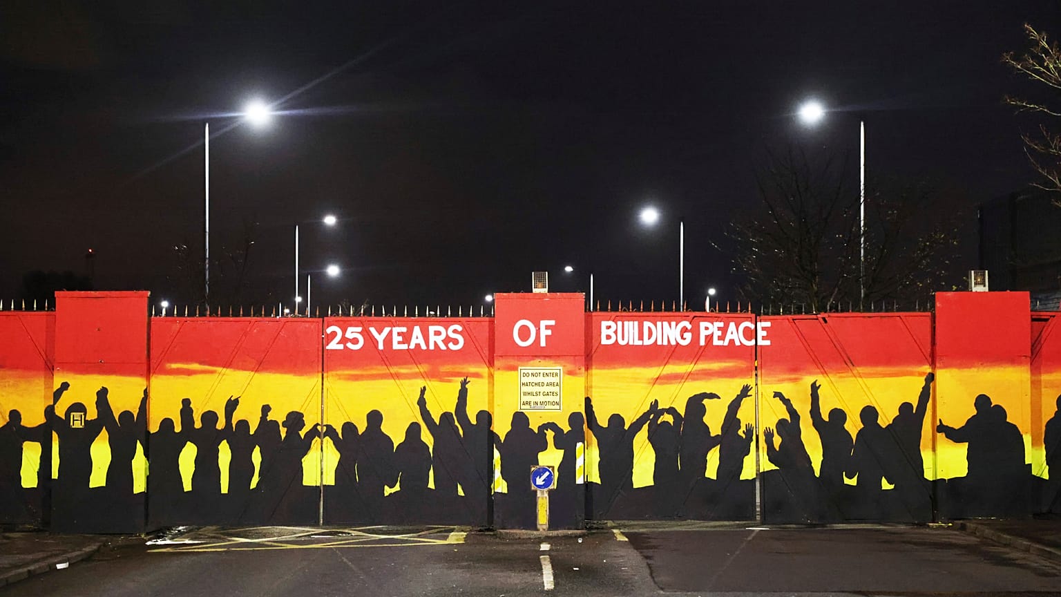 A mural on the peace gates at Lanark Way In Belfast celebrates 25 years since the Good Friday Agreement
