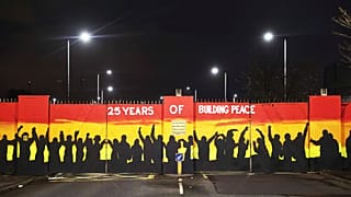 A mural on the peace gates at Lanark Way In Belfast celebrates 25 years since the Good Friday Agreement