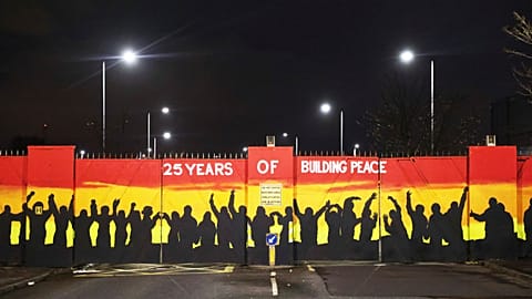 A mural on the peace gates at Lanark Way In Belfast celebrates 25 years since the Good Friday Agreement