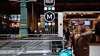 A passenger at a Metro station in Paris