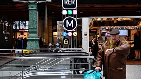 A passenger at a Metro station in Paris