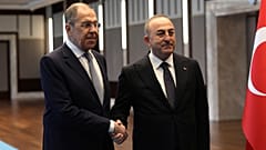 Turkish Foreign Minister Mevlut Cavusoglu, right, and his Russian counterpart Sergey Lavrov pose for photos before their talks, in Ankara, Turkey, Friday, April 7, 2023.