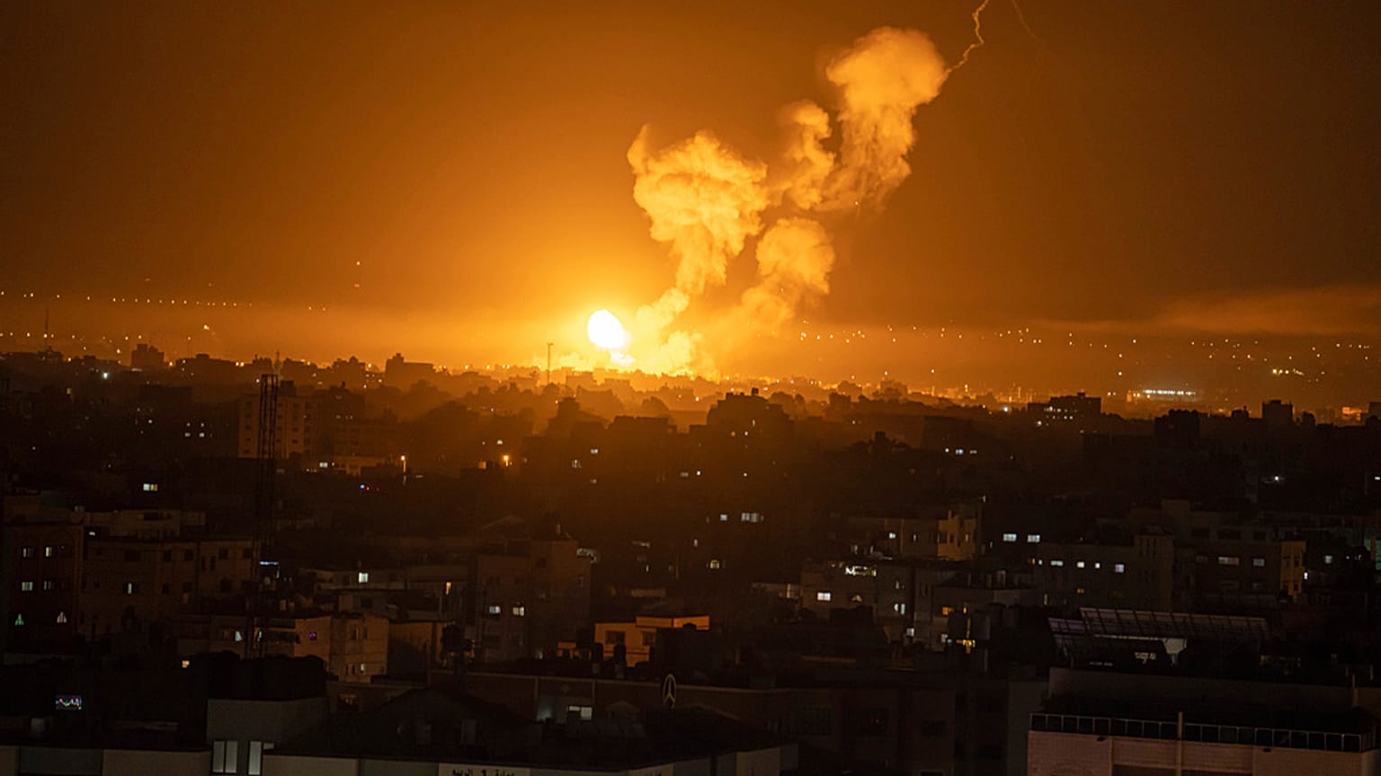 Fire and smoke rise following an Israeli airstrike in central Gaza Strip, Friday, April 7, 2023. 
