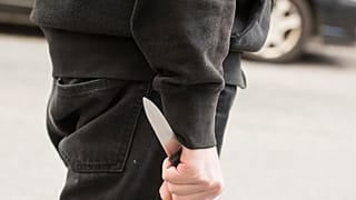 A man hold a hidden blade.