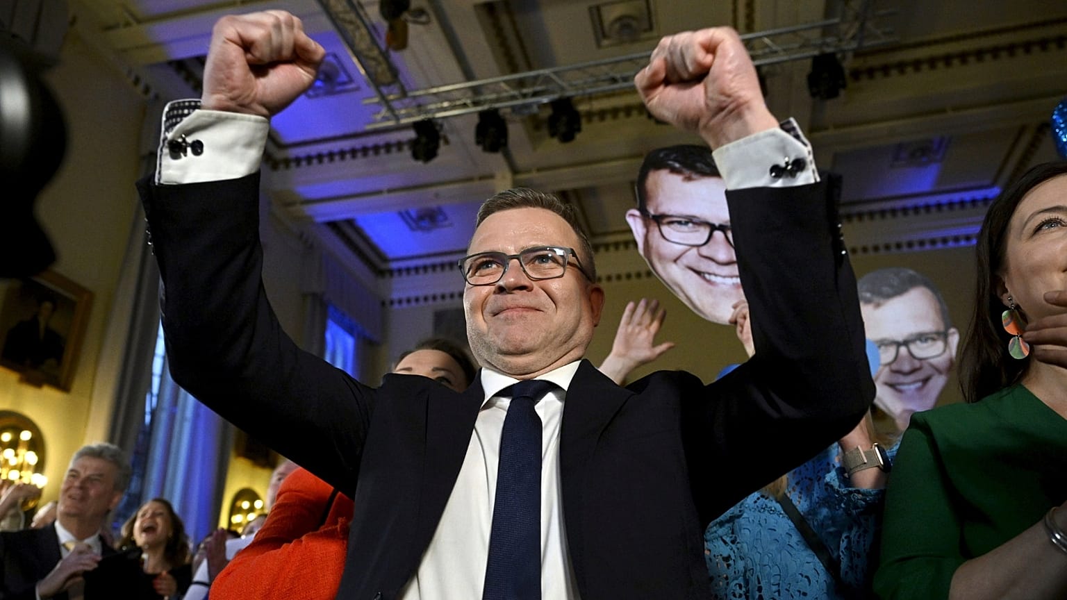 National Coalition Chairman Petteri Orpo celebrates at the party's parliament election wake after seeing the results of the advance votes in Helsinki, Finland, Sunday, April 2