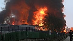 Huge flames rise from a fire in Hamburg, Germany, Sunday April 9, 2023.