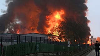 Huge flames rise from a fire in Hamburg, Germany, Sunday April 9, 2023.