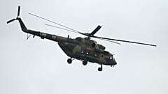 A Chinese military helicopter flies over Pingtan island, the closest point to Taiwan, in China's southeast Fujian province on April 7, 2023.