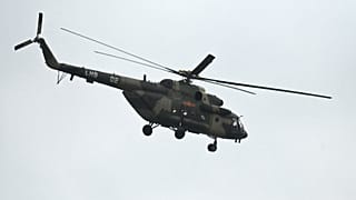 A Chinese military helicopter flies over Pingtan island, the closest point to Taiwan, in China's southeast Fujian province on April 7, 2023.