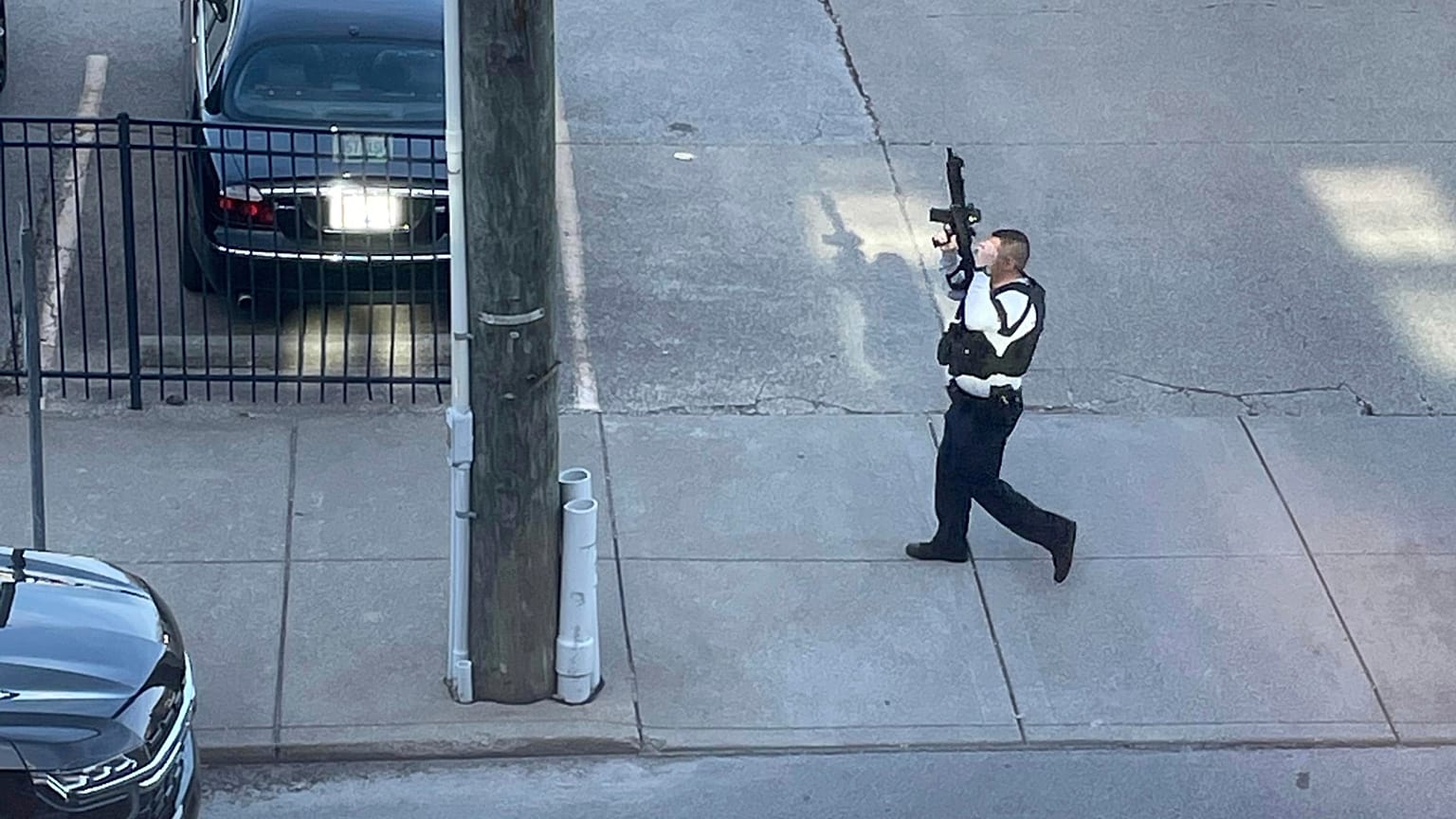 This photo provided by Reid Cornell shows police presence near the scene of a shooting in Louisville, Ky., Monday, April 10, 2023.