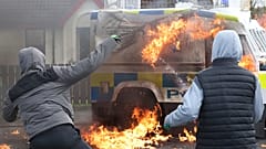Police car firebombed in protest against Northern Ireland peace deal