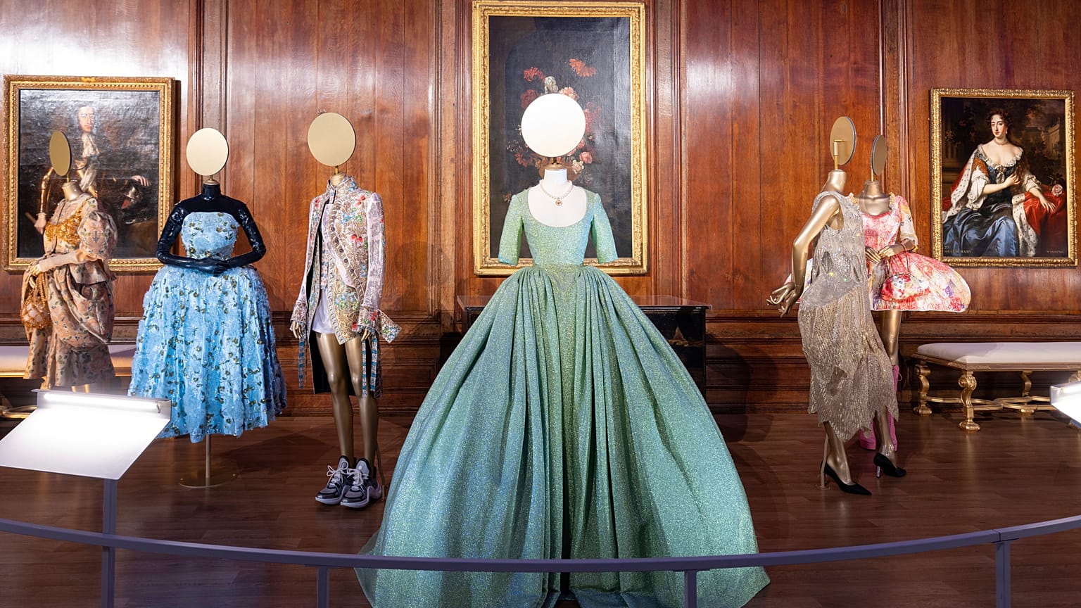 A view of the Queen's Gallery displaying costumes at the Crown to Couture exhibition