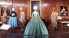 A view of the Queen's Gallery displaying costumes at the Crown to Couture exhibition