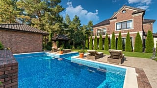 Rich communities with large swimming pools and well-kept gardens are leaving poorer communities without basic access to water, scientists say.