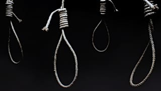 Nooses in an dark room.
