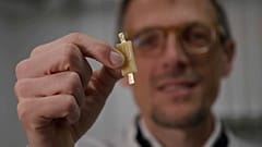 Mario Caironi, Project Coordinator at the Italian Institute of Technology displays an edible battery made entirely from food products.