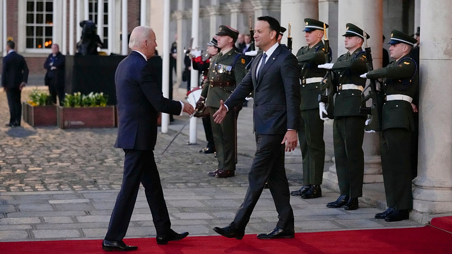 President Joe Biden shakes hands with Ireland's Taoiseach Leo Varadkar as he arrives for a banquet at Dublin Castle in Dublin, Ireland, Thursday, April 13, 2023