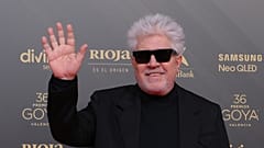 Spanish film director Pedro Almodovar poses on the red carpet upon arrival at the 36th Goya awards ceremony at the Palau de les Arts in Valencia, on February 12, 2022.