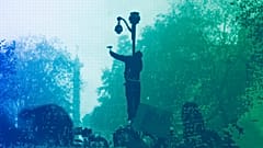 A protester uses a hammer to break a CCTV camera during a demonstration against a security law that would restrict sharing images of police in Paris, November 2020