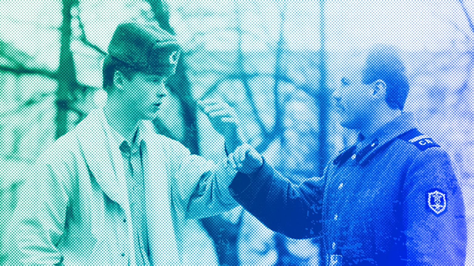 A soldier explains to a young man he would prefer to be a civilian during a street discussion in Vilnius, 26 March 1990
