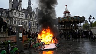 Bicycles burn during a protest outside the Paris City Hall, Friday, April 14, 2023 in Paris.