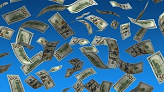 عکس تزئینی از پرواز اسکناس‌ها در آسمان